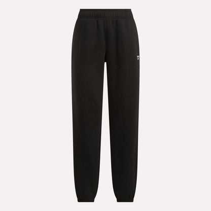 Reebok Women's Medium Vector Sweatpants in black with an elastic waistband and cuffed ankles, shown on a plain light background. Crafted from soft cotton-blend fabric with a small white Reebok logo on the upper left thigh.