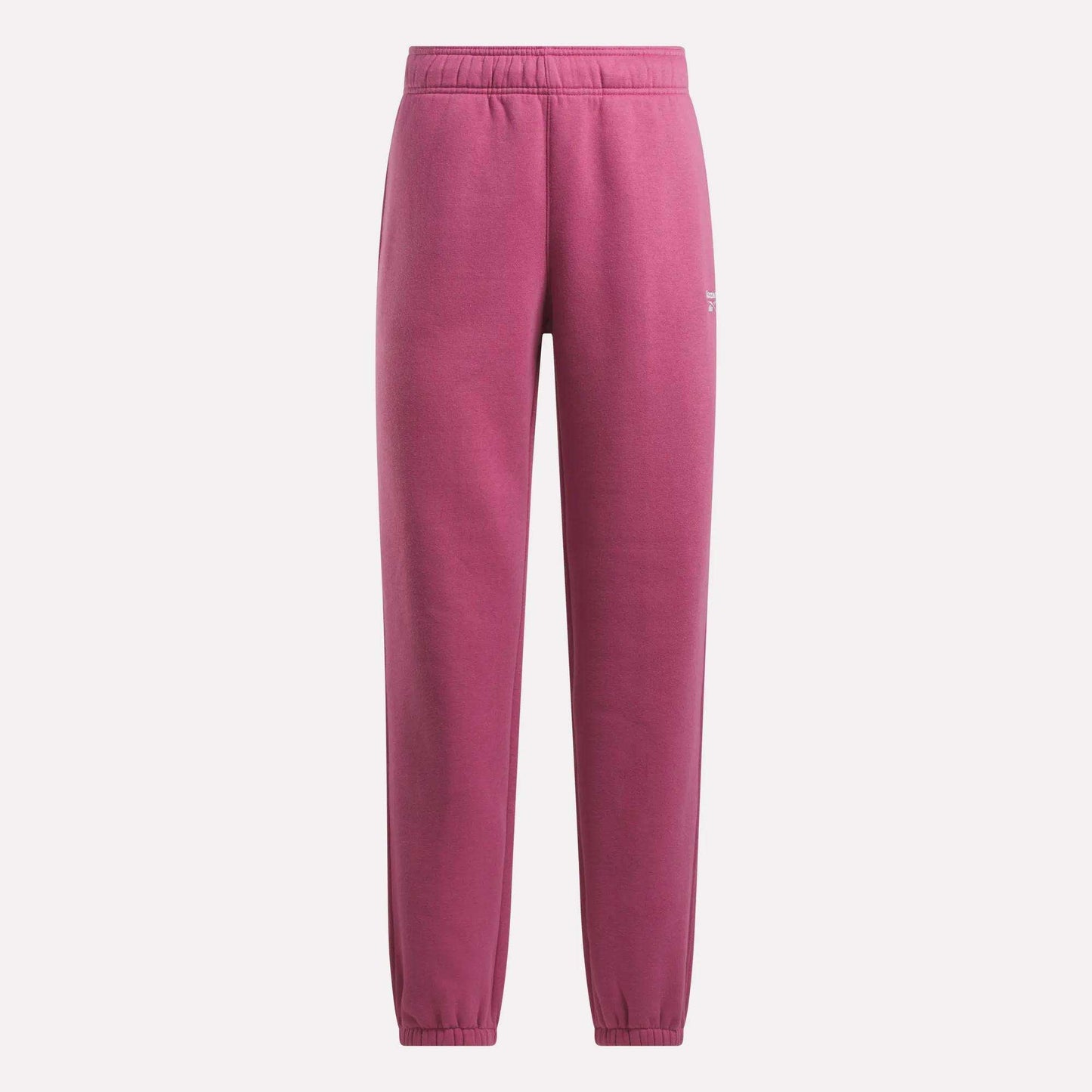 Magenta Reebok Women's Medium Vector Sweatpants with elastic waistband and cuffs shown on a plain light background. Minimalist cotton-blend design features a small white logo near the left pocket.
