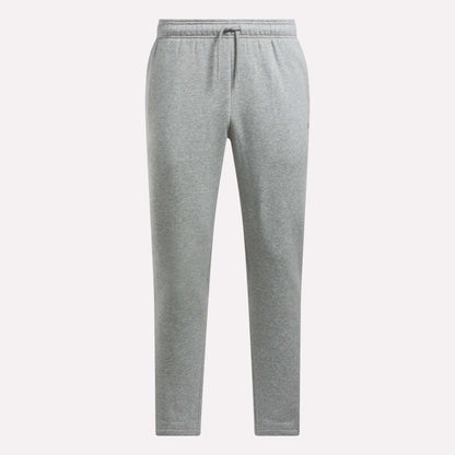 Reebok Men's Patent Pants in light gray feature an adjustable waistband with drawstring, side pockets, soft fabric for comfort, and a slim, straight-leg fit.