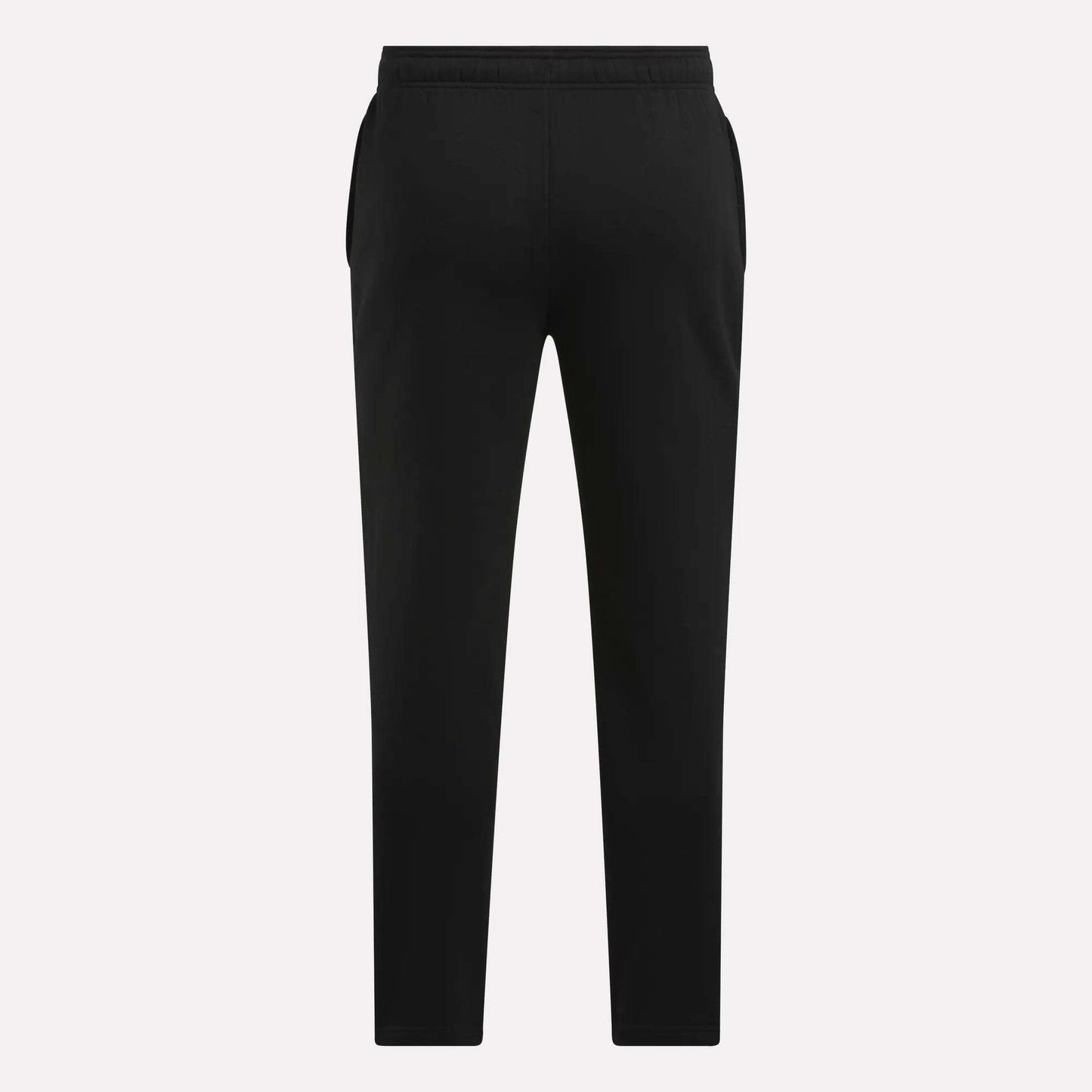 Men's Patent Pants by Reebok in black, featuring a slim fit, elastic waistband, and tapered legs, shown from the back against a plain light background.