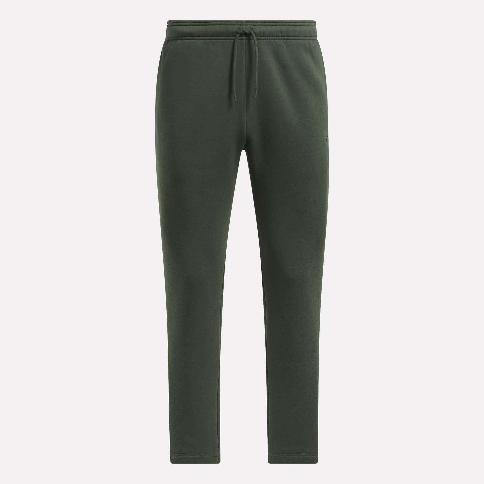 Men's Patent Pants by Reebok in dark green, with adjustable waistband and drawstring, slim fit tapered legs, shown on a plain light background.