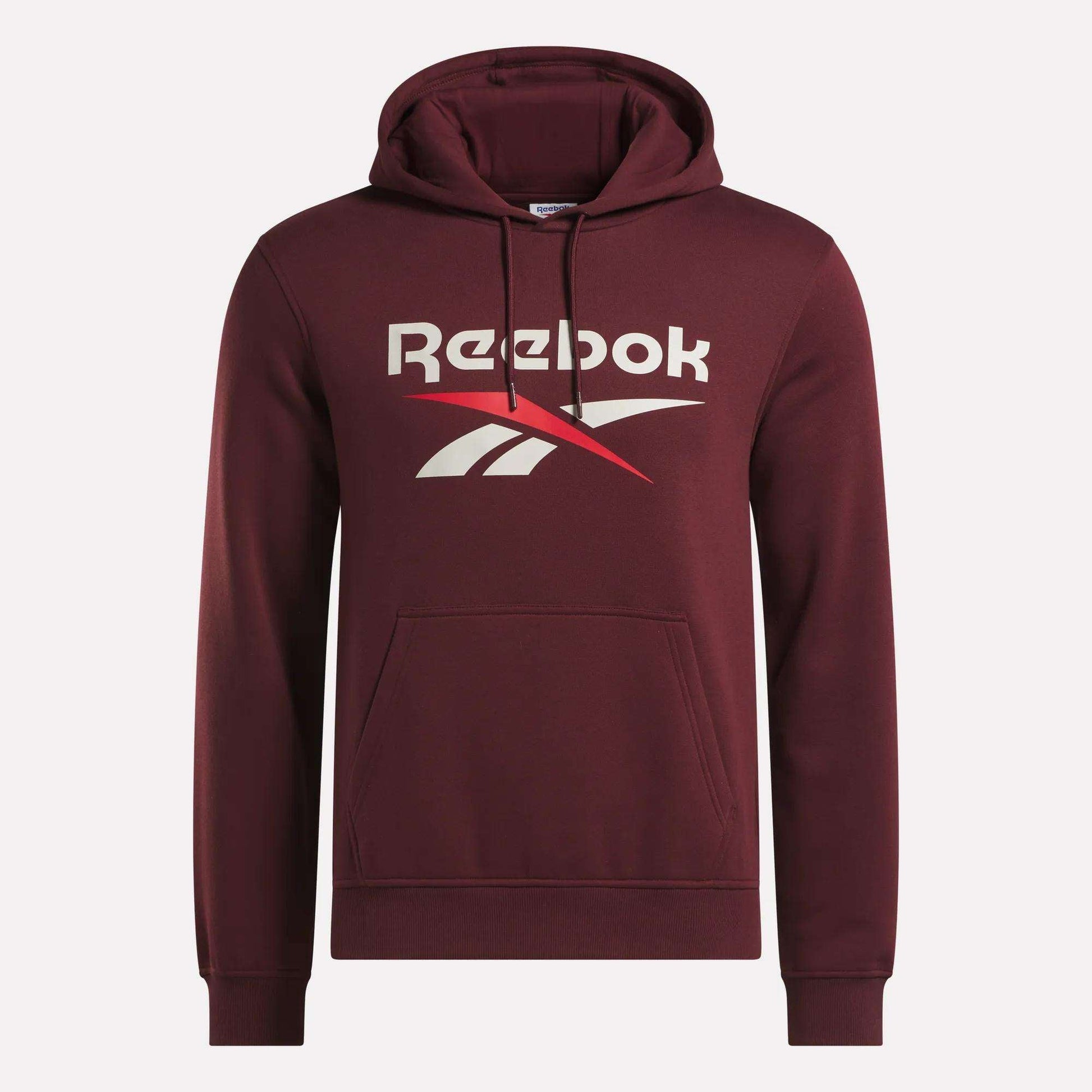 The Men's Logo Hoodie by Reebok is a maroon pullover for men with a front kangaroo pocket, drawstring hood, and bold white and red Reebok logo on the chest, crafted from soft cotton-blend fleece for comfort.
