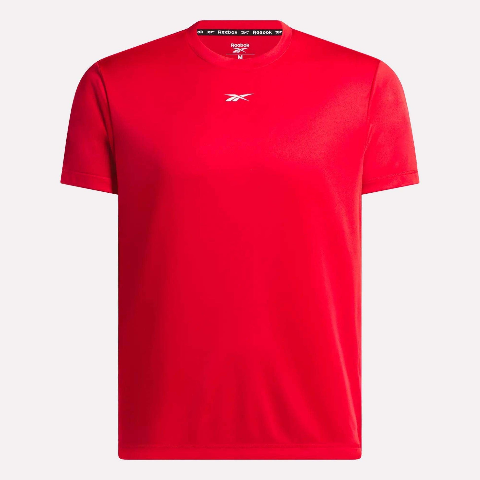 The Reebok Men's Short Sleeve Tech Training T-Shirt is plain red with a small white logo on the chest, branded collar lining, and made from breathable RBK-DRY fabric, shown against a white background.