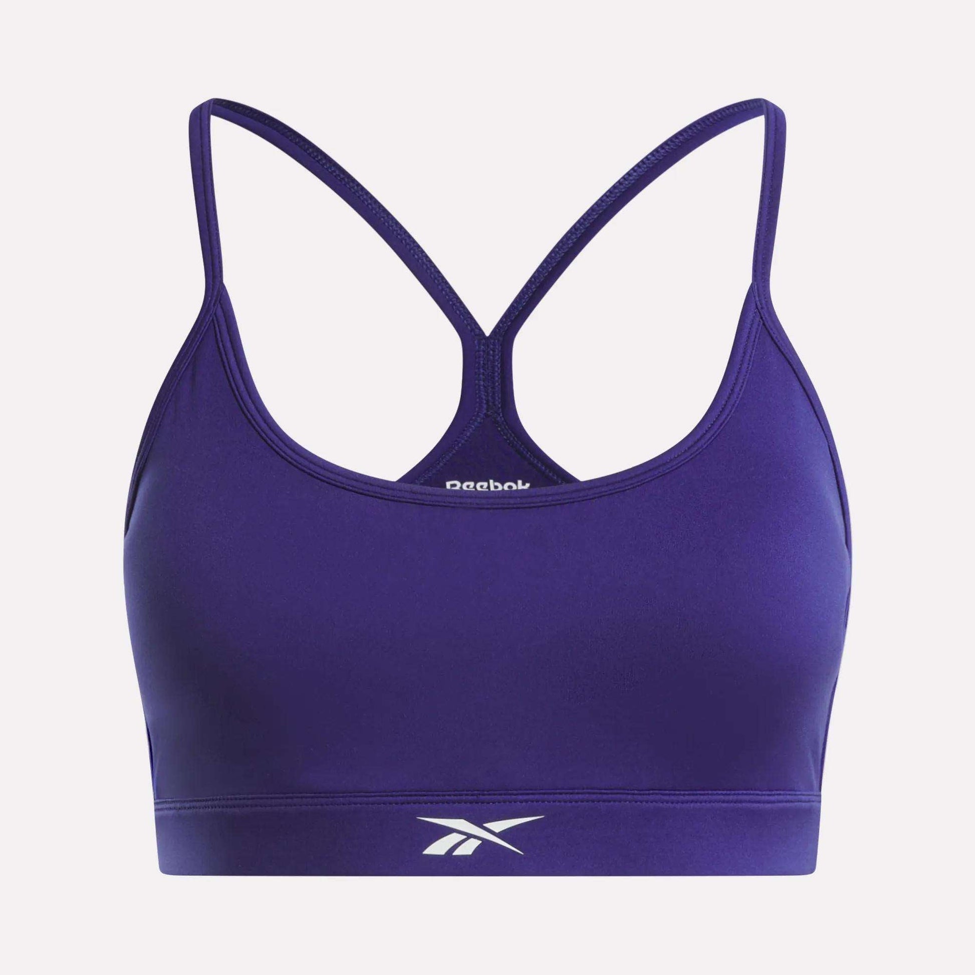 The Reebok Women's Strappy Sports Bra features a racerback design with spaghetti straps and the iconic logo on the front band. Made from quick-drying fabric, it's ideal for medium-impact workouts.