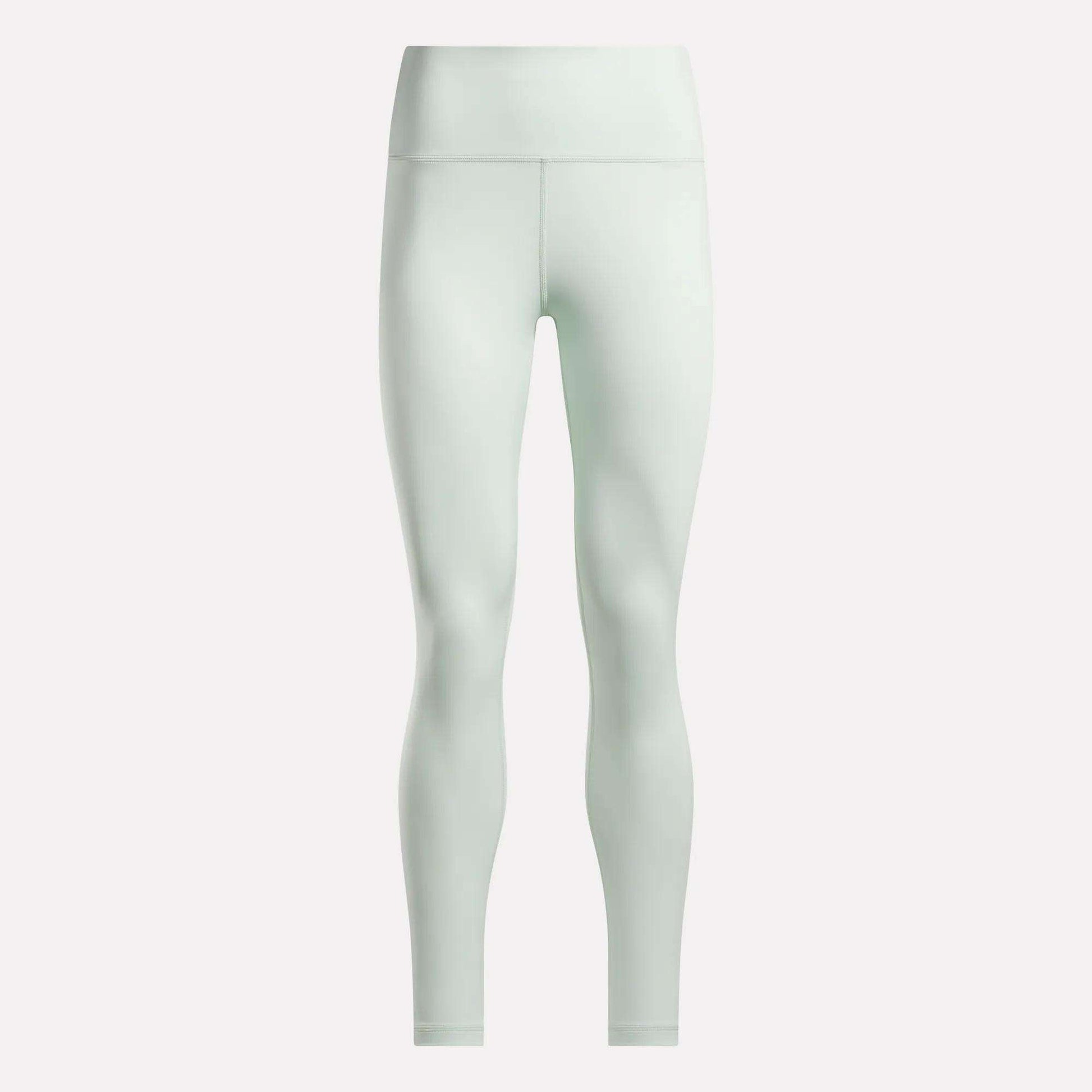 Reebok Women's High-Rise Leggings in light green, made from moisture-wicking RBK-DRY fabric, are shown full-length against a plain white background.