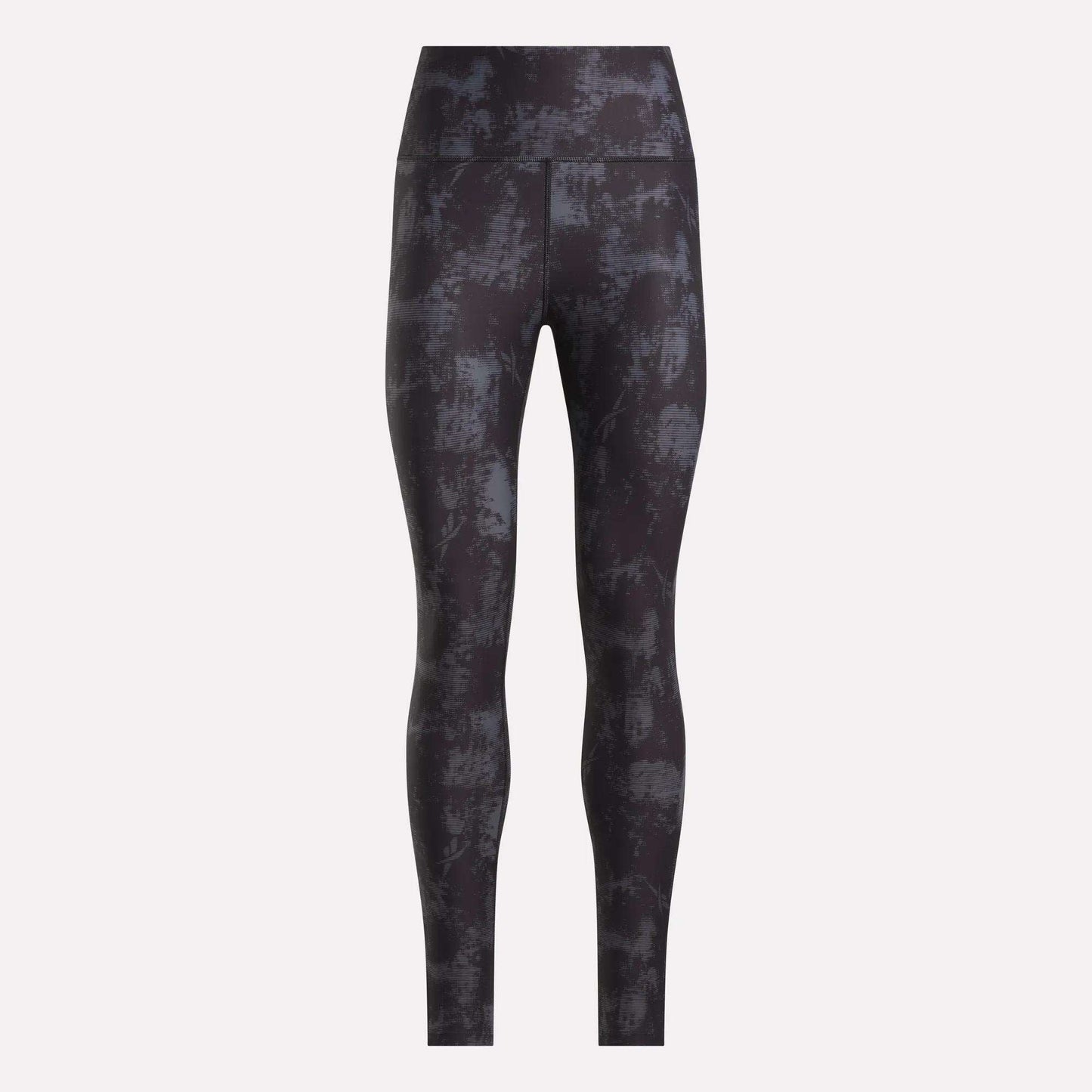 Reebok Women's High-Rise Printed Leggings showcase an abstract dark gray and black design, made from sweat-wicking fabric, shown against a plain light background.