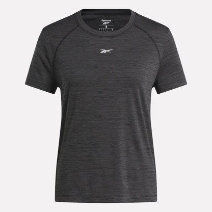 A women's Reebok Training T-Shirt in dark grey is shown on a white background. This short-sleeved tee has a crew neckline and features a small white Reebok logo on the chest.