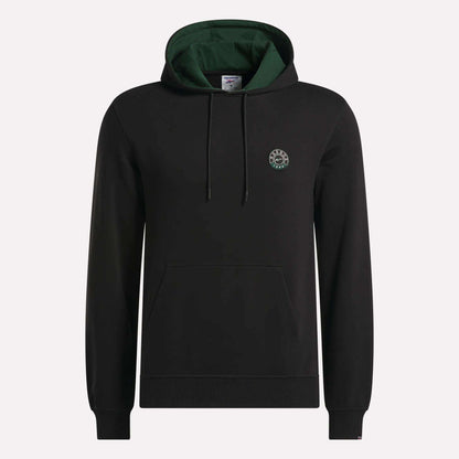 The Reebok Men's French Terry Hoodie is crafted from comfortable French terry fabric and features a black design with a green-lined hood, adjustable drawstrings, a convenient front pocket, and a small circular logo on the left chest. The hoodie is shown against a plain light background.