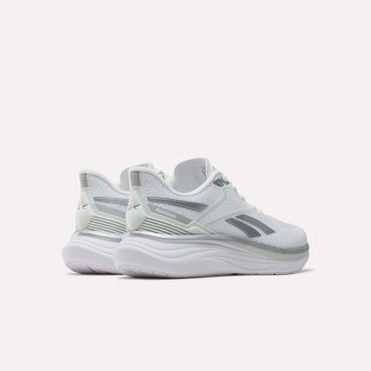 A pair of Reebok Women's Viva Speed Shoes in white with gray accents and a thick, cushioned midsole, positioned at an angle on a plain white background.