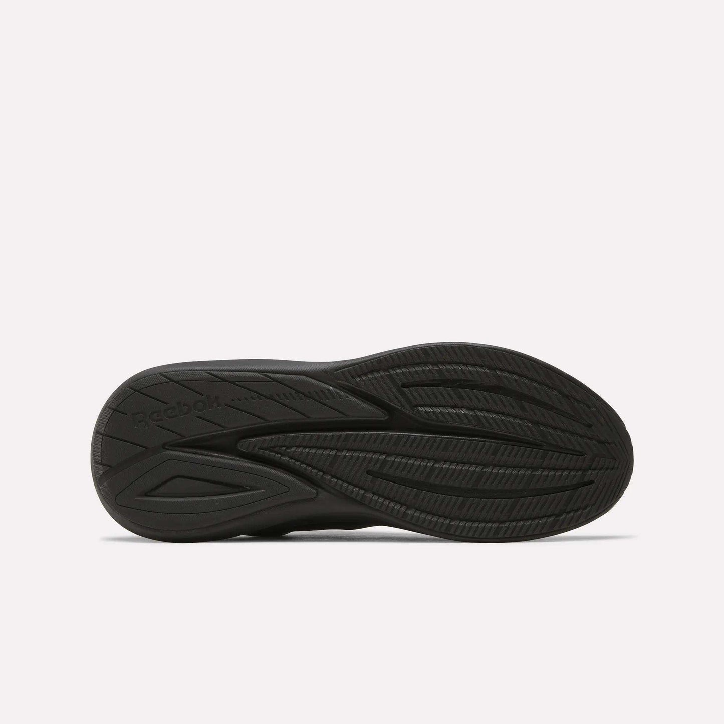 The image displays the black rubber outsole of Men's Viva Speed Shoes by Reebok, highlighting textured grooves and patterns for traction, set against a plain white background.