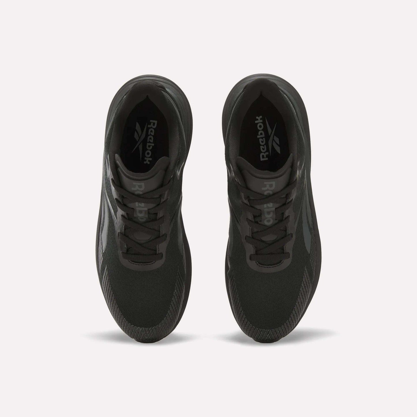 Top view of a pair of black Reebok Men's Viva Speed Shoes with laces, side by side on a light background. These cushioned running shoes display the Reebok logo on the insoles for comfort and support.