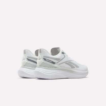 A pair of Men's Viva Speed Shoes by Reebok is displayed on a white background, angled to showcase the sides and back. These white shoes with gray accents offer breathable construction and cushioned support, making them ideal for athletic activities and everyday comfort.