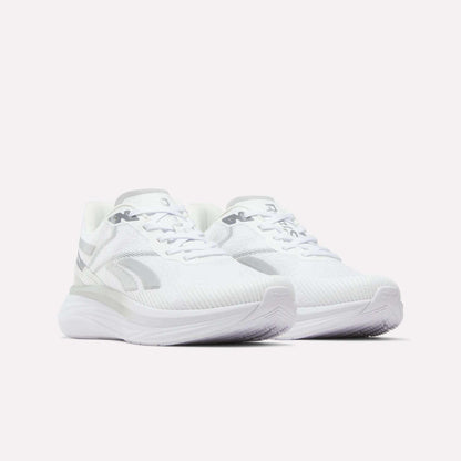 A pair of Men's Viva Speed Shoes by Reebok in white with subtle gray accents, showcasing a cushioned and breathable design, viewed from a front angle and set against a plain white background.