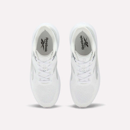 A pair of Men’s Viva Speed Shoes by Reebok in white is displayed from above on a light background, highlighting the Reebok logo on the insoles and the mesh uppers for enhanced breathability.
