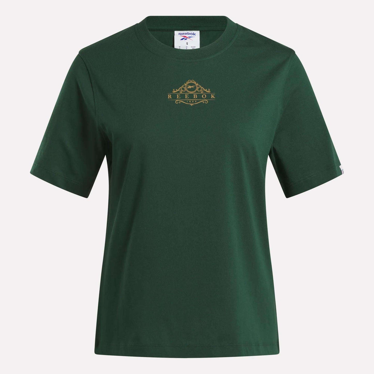 The Women's Fitted Graphic T-Shirt by Reebok features a plain dark green design with short sleeves, a crew neckline, and a small gold Reebok logo with a decorative detail on the chest. Made from soft cotton, this durable graphic tee delivers comfort and classic everyday style.