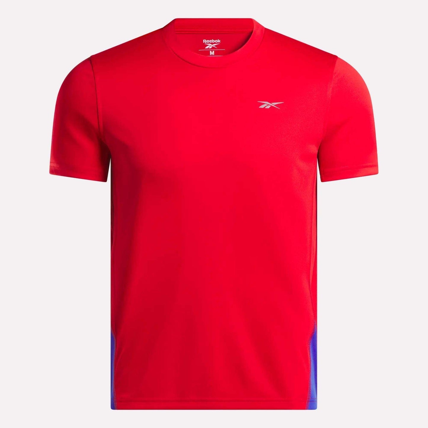 The Men's Short Sleeve Vector T-Shirt by Reebok is bright red with RBK-DRY tech, subtle blue side accents, and a small white logo on the left chest, shown against a plain white background.