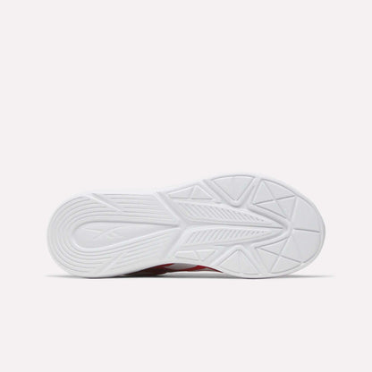 The image shows the white sole of the Reebok Rush Runner 6.0 Running Shoes for big kids, featuring textured geometric patterns and traction grooves, set against a plain white background.