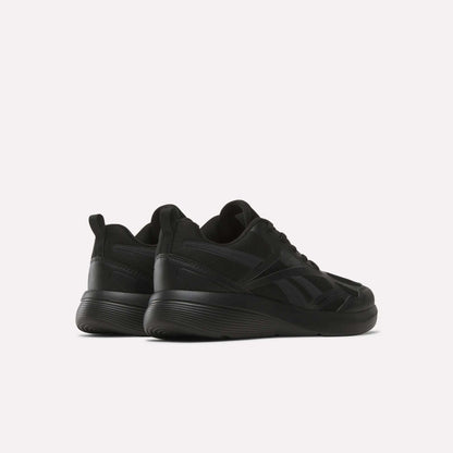 The Rush Runner 6.0 Running Shoes for big kids by Reebok are shown in black, featuring thick EVA midsoles, set against a white background and angled to display both the back and side views.
