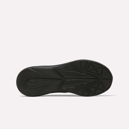 The black rubber sole of the Reebok Rush Runner 6.0 Running Shoes - Big Kids features a geometric tread pattern and EVA midsole, shown from the bottom against a plain white background.