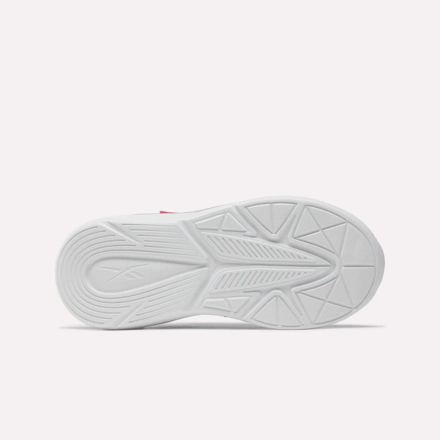 Bottom view of the Rush Runner 6.0 Elastic Lace Top Strap Running Shoes for little kids by Reebok, showing a white rubber sole with geometric tread patterns and a subtle logo on the heel, inspired by classic Reebok designs against a plain light background.