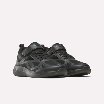 The Reebok Rush Runner 6.0 Elastic Lace Top Strap Running Shoes for little kids feature a black design with Velcro and laces, a textured sole, and subtle details—perfect for all-day play, shown against a plain light background.