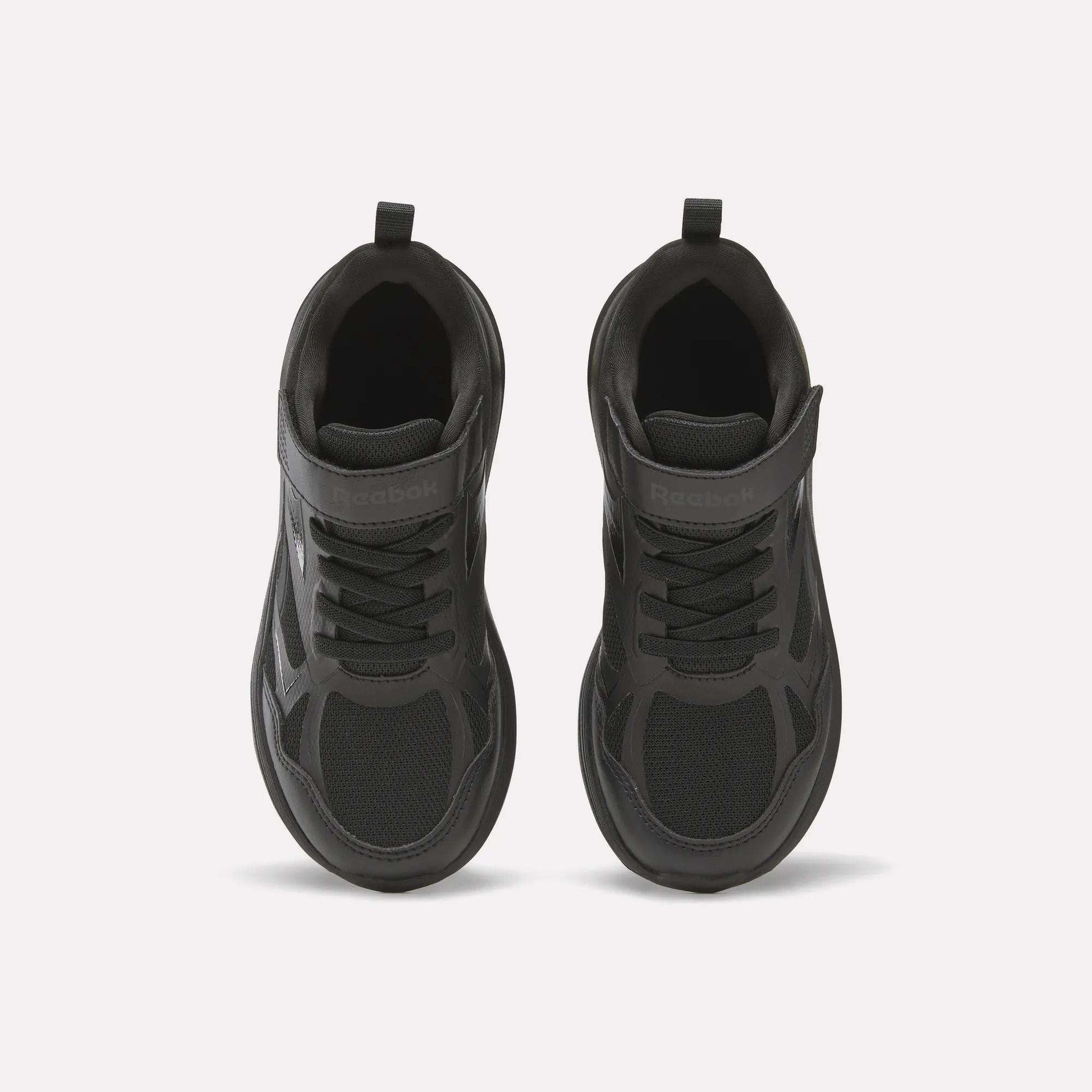 Top view of Reebok Rush Runner 6.0 Elastic Lace Top Strap Running Shoes for little kids, featuring mesh and synthetic materials, elastic laces, and a top strap—ideal for all-day play, shown on a plain light background.