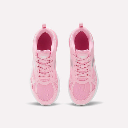 Top view of a pair of light pink Reebok Rush Runner 6.0 Running Shoes for big kids, featuring white EVA midsoles and laces, arranged side by side on a plain white background.