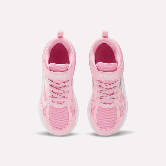The Reebok Rush Runner 6.0 Elastic Lace Top Strap Running Shoes for little kids are pink with white soles. Shown from above against a light background, these shoes feature mesh details and laces, offering style and comfort for active girls.