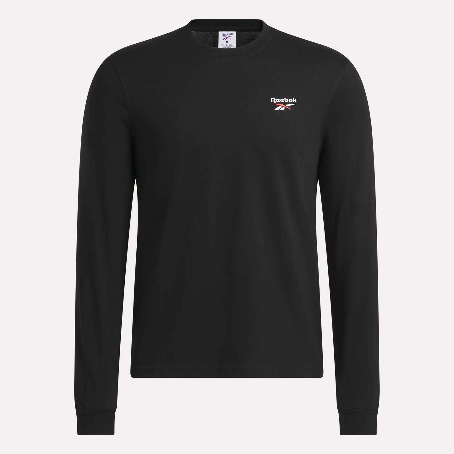 The Reebok Men's Long Sleeve T-Shirt is shown against a plain light background, featuring a classic crew neck design in black, soft cotton fabric, and a small white Reebok logo on the left chest.