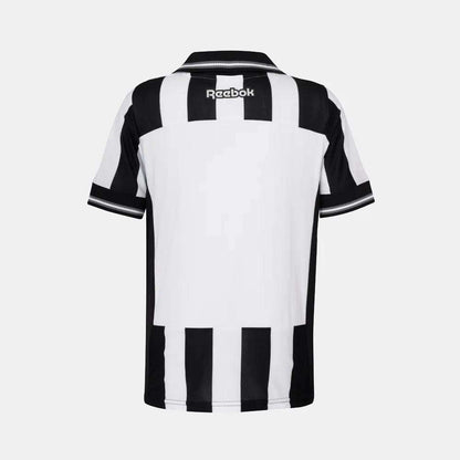 The Kids' Botafogo Youth Home Jersey by Reebok features black and white stripes, a black collar, and the Reebok logo on the back—an iconic 25/26 football shirt for young fans.