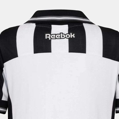 Back view of the Kids' Botafogo Youth Home Jersey by Reebok, featuring black and white stripes, a black collar, and a white Reebok logo on the upper back—a stylish 25/26 football shirt.