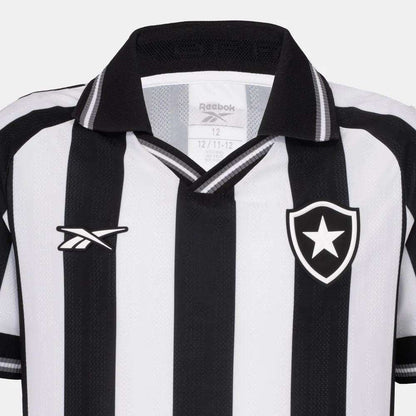 The Kids' Botafogo Youth Home Jersey by Reebok features classic black and white stripes, a collar, the Reebok logo on one side, and a shield with a white star—perfect for young fans of the 25/26 home shirt design.