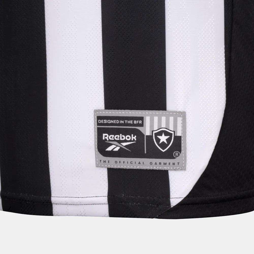 A close-up of the Botafogo Men's Home Jersey by Reebok features black and white stripes, the Reebok logo, and the Botafogo club badge on a rectangular patch near the bottom.