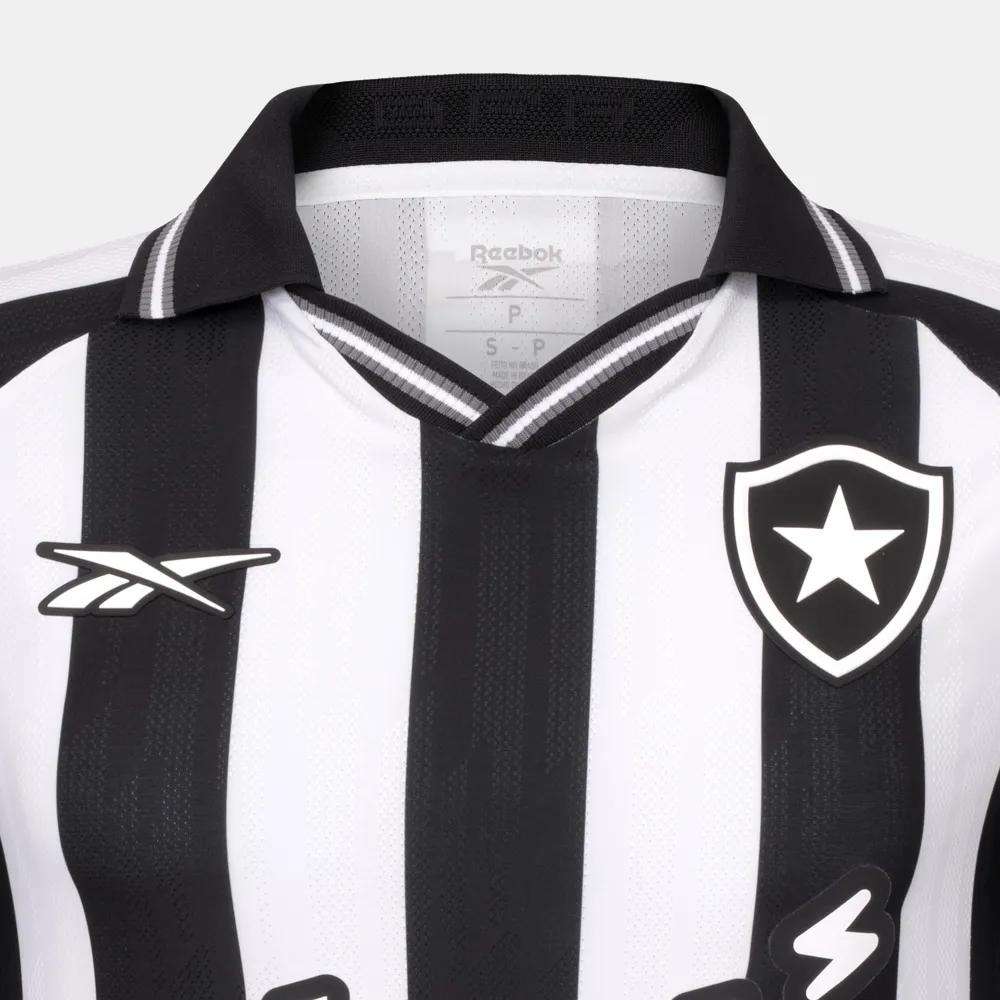 Close-up of the Botafogo Men's Home Jersey by Reebok, displaying black and white stripes, a Reebok logo on the left chest, and a star-shaped crest on the right—showcasing the iconic 25/26 home design.
