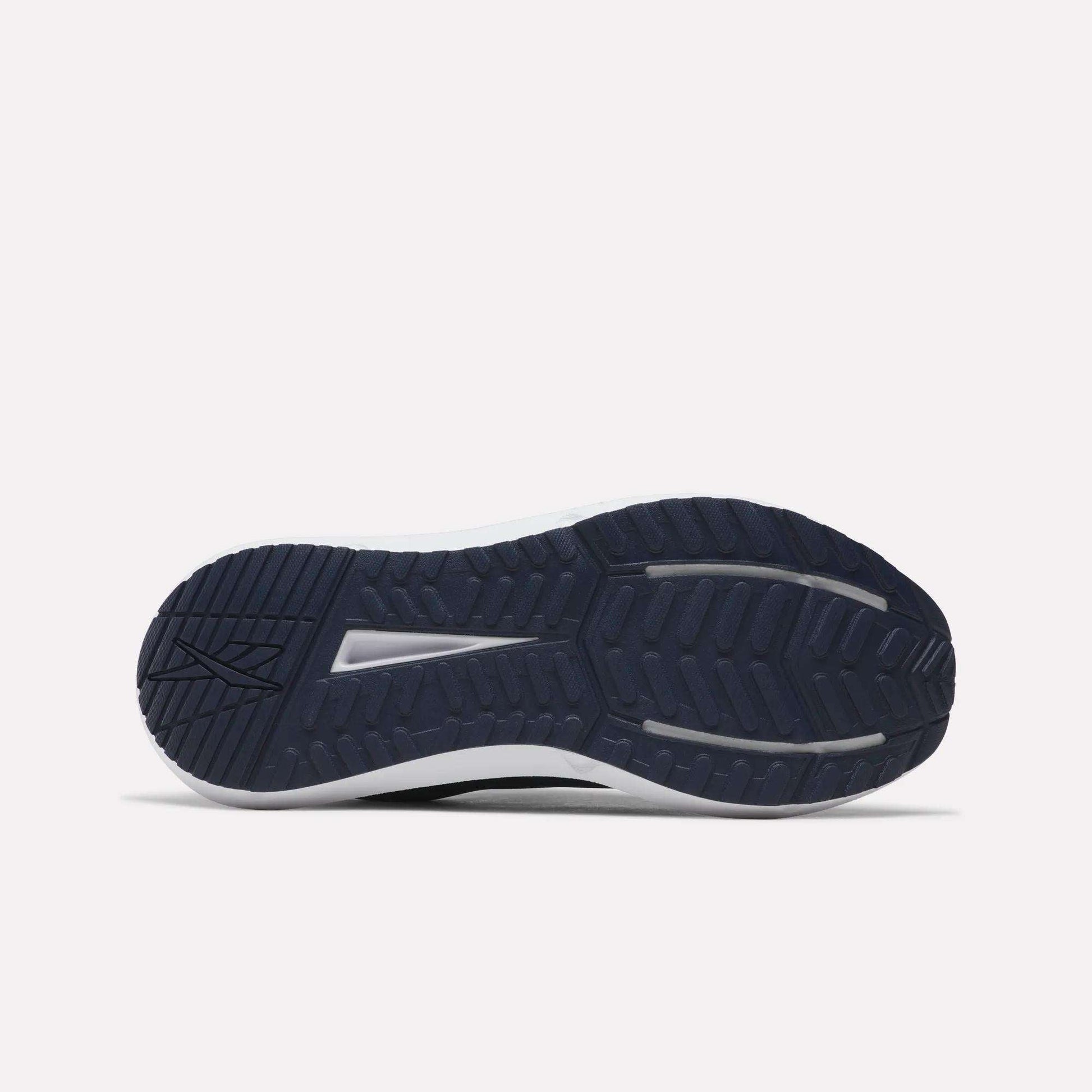 The image displays the navy blue outsole of Reebok Men's Cityride 2 Running Shoes, featuring textured tread patterns, as seen from the bottom against a plain white background.