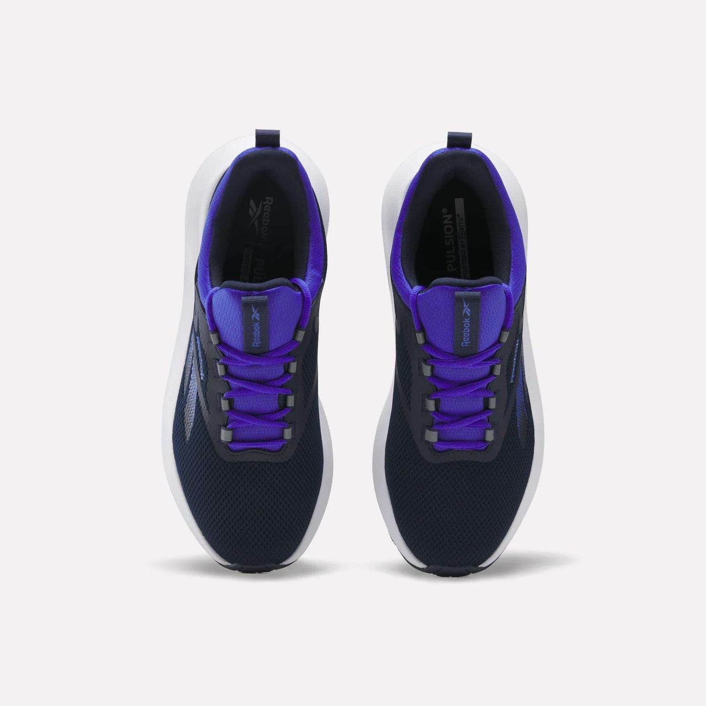 A pair of Reebok Men's Cityride 2 Running Shoes in navy blue, featuring white soles, purple accents, and FuelFoam cushioning, are displayed from above on a plain white background.