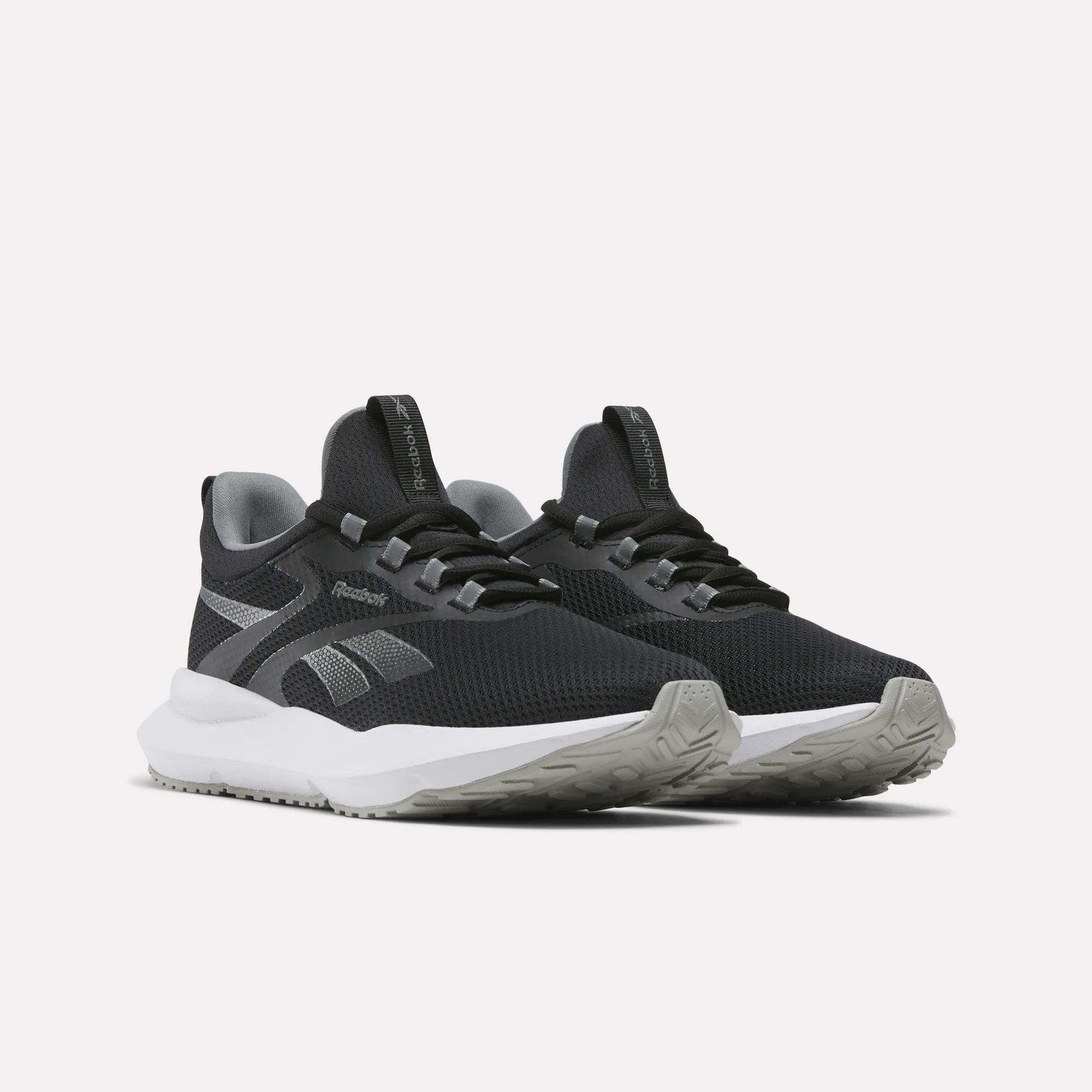 A pair of Reebok Women's Cityride 2 Running Shoes in black with gray accents, FuelFoam cushioning, and white soles is displayed on a light background.