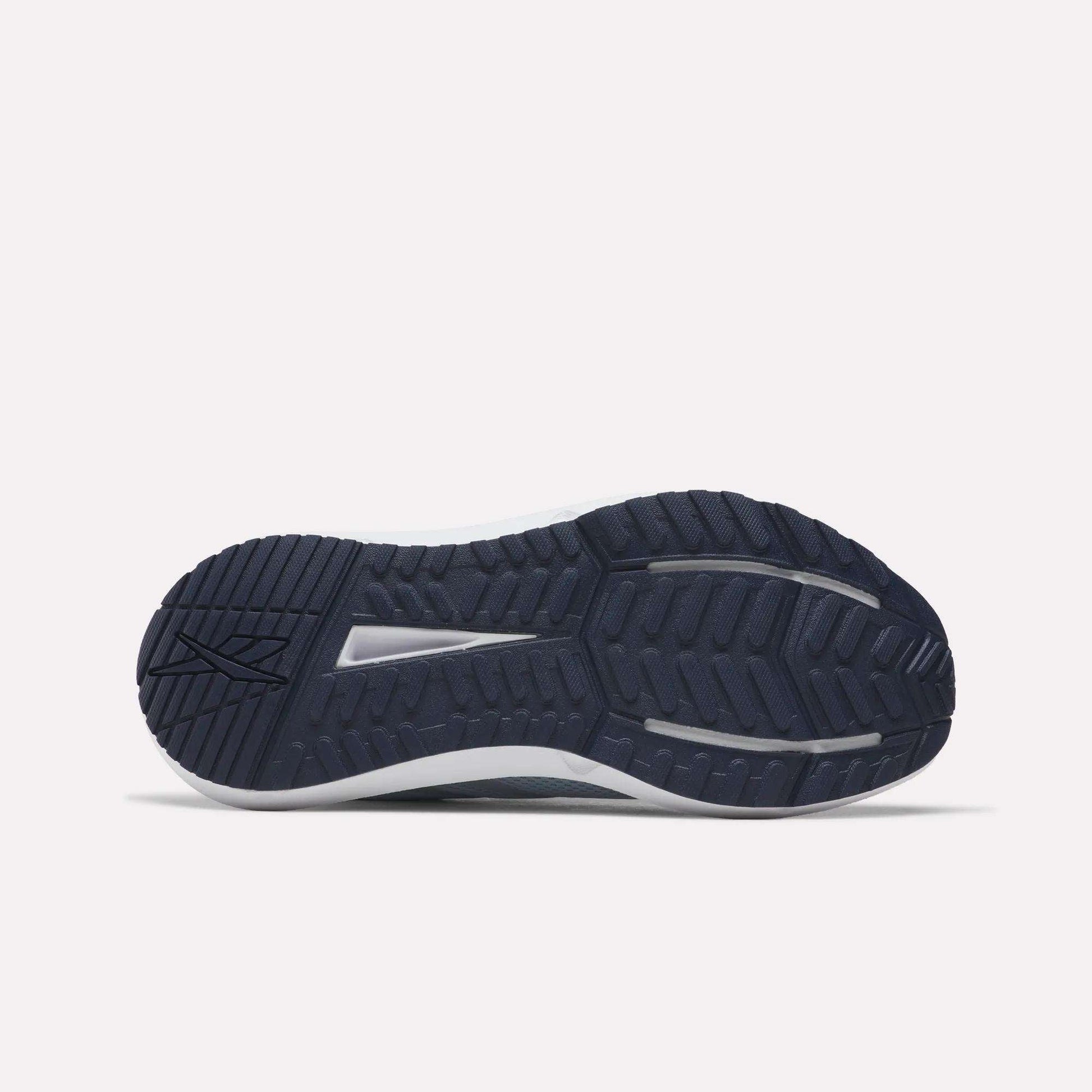 The image displays the dark blue, textured rubber outsole of Reebok Women's Cityride 2 Running Shoes, revealing multiple tread patterns and grooves as seen from the bottom against a plain light background.