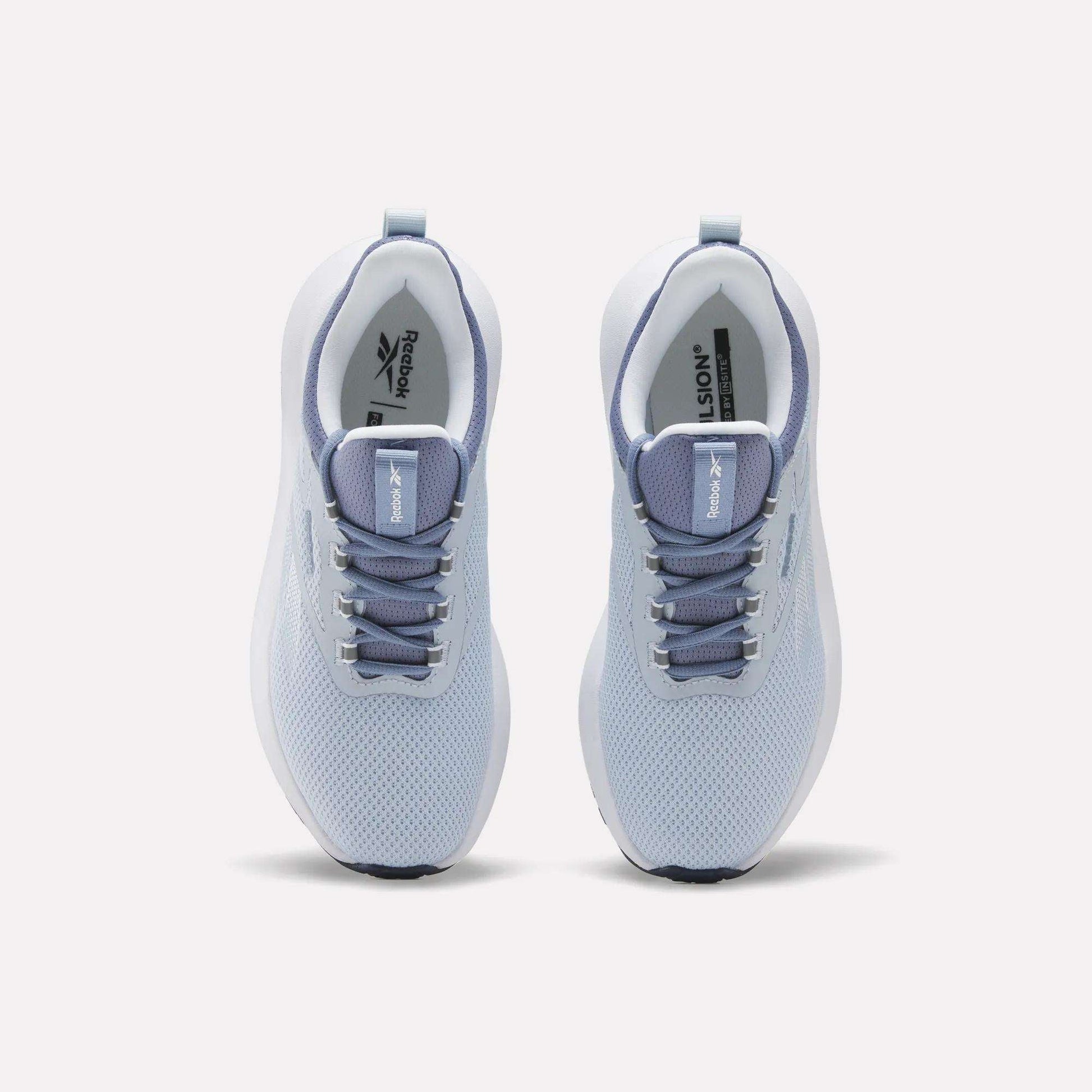 Top view of Reebok Women's Cityride 2 Running Shoes in light blue with white soles, grayish blue laces, and mesh uppers. The Reebok logo appears on the tongue and insoles. Features FuelFoam cushioning for all-day comfort.