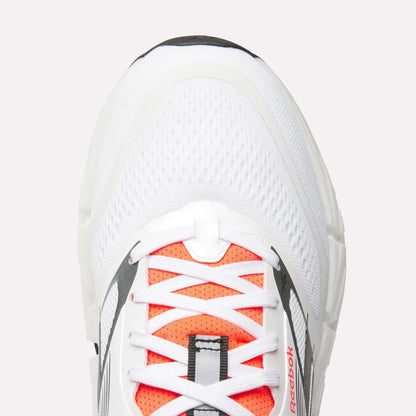 Top view close-up of Men's Reebok FloatZig 2 Running Shoes with orange accents, white laces, mesh upper, supportive design, and small logo by the laces. Features Superfloat+ cushioning for comfort.