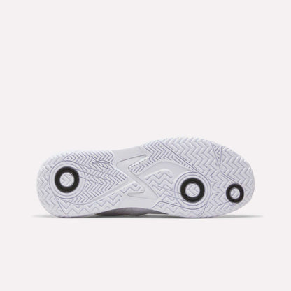 The image displays the white rubber outsole of the Reebok Phase EVO Tennis Shoes, featuring a durable herringbone tread pattern and three black circles, photographed on a plain white background.