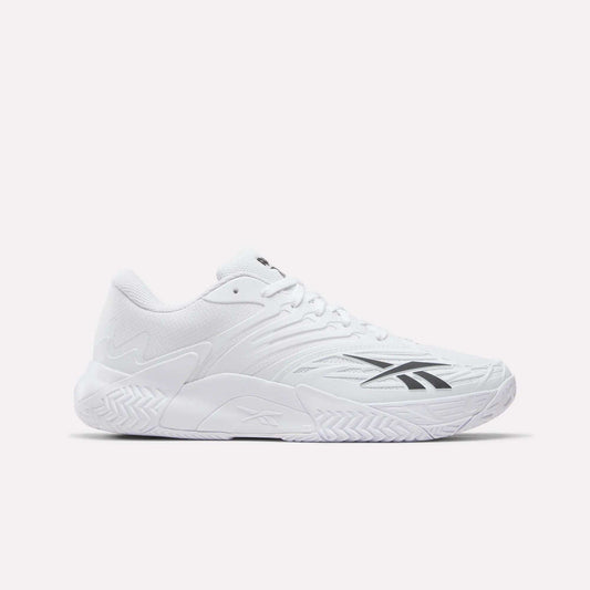 The Reebok Phase EVO Tennis Shoes feature a white mesh upper, textured sole, and black Reebok logo on the side—durable athletic sneakers ideal for tennis. Shown against a light plain background.