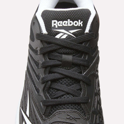 Close-up of the Women's Phase Evo Tennis Shoes by Reebok in black with white accents, featuring laces, mesh texture, side design, and the Reebok logo on the tongue.