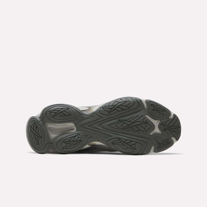 The image shows the sole of the Reebok Mita Sneakers x DMX Series 3000 Shoes, with a dark rubber outsole featuring wavy, grooved traction patterns and leaf-like designs against a plain white background.