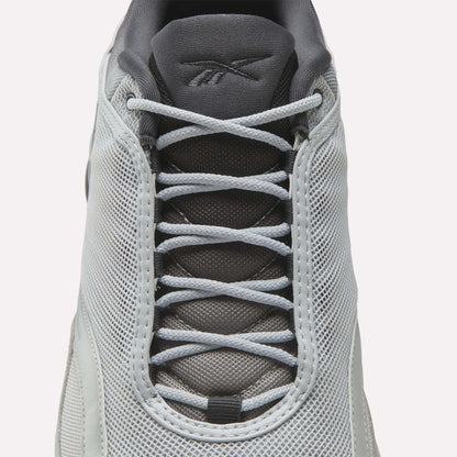 Top view of a white Reebok Mita Sneakers x DMX Series 3000 shoe with light gray laces, mesh upper, and dark gray tongue with the Reebok logo—features DMX moving air technology for enhanced comfort.