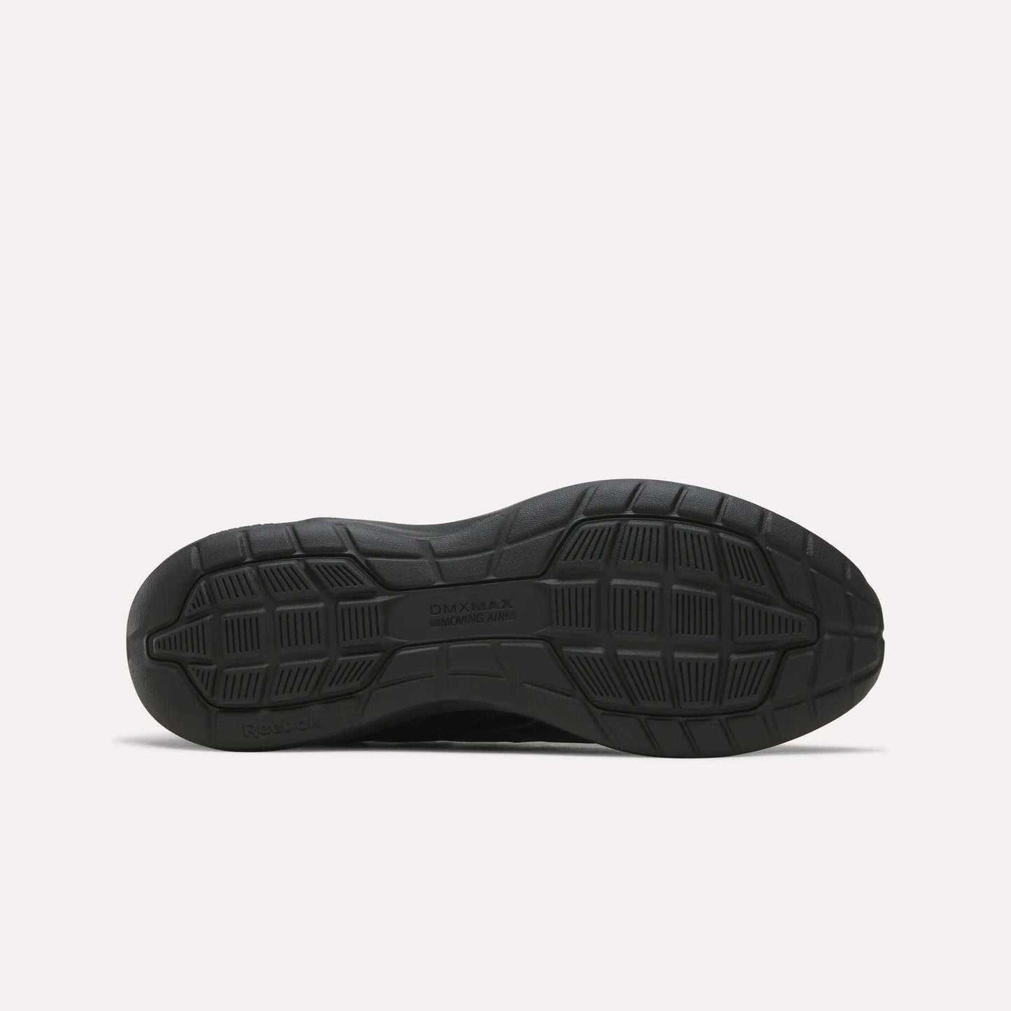 The image displays the black rubber sole of the Reebok Men's Walk Ultra 7 DMX Max Shoes, positioned flat to showcase its tread pattern. The sole includes textured grip sections and features DMX MAX and Reebok embossed on it, emphasizing the advanced DMX cushioning technology characteristic of these cushioned walking shoes.
