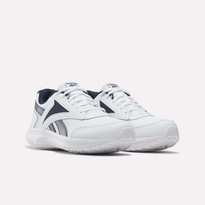 A pair of Men's Walk Ultra 7 DMX Max Shoes by Reebok in white with navy blue accents and white soles, featuring DMX cushioning for enhanced comfort, displayed on a plain light background. Perfect as cushioned walking shoes, these sneakers provide both style and support for everyday wear.