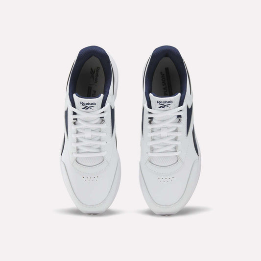 A top-down view of the Men's Walk Ultra 7 DMX Max Shoes by Reebok, featuring a white design with navy blue accents and DMX cushioning, displays the tops and laces of both shoes against a plain white background.