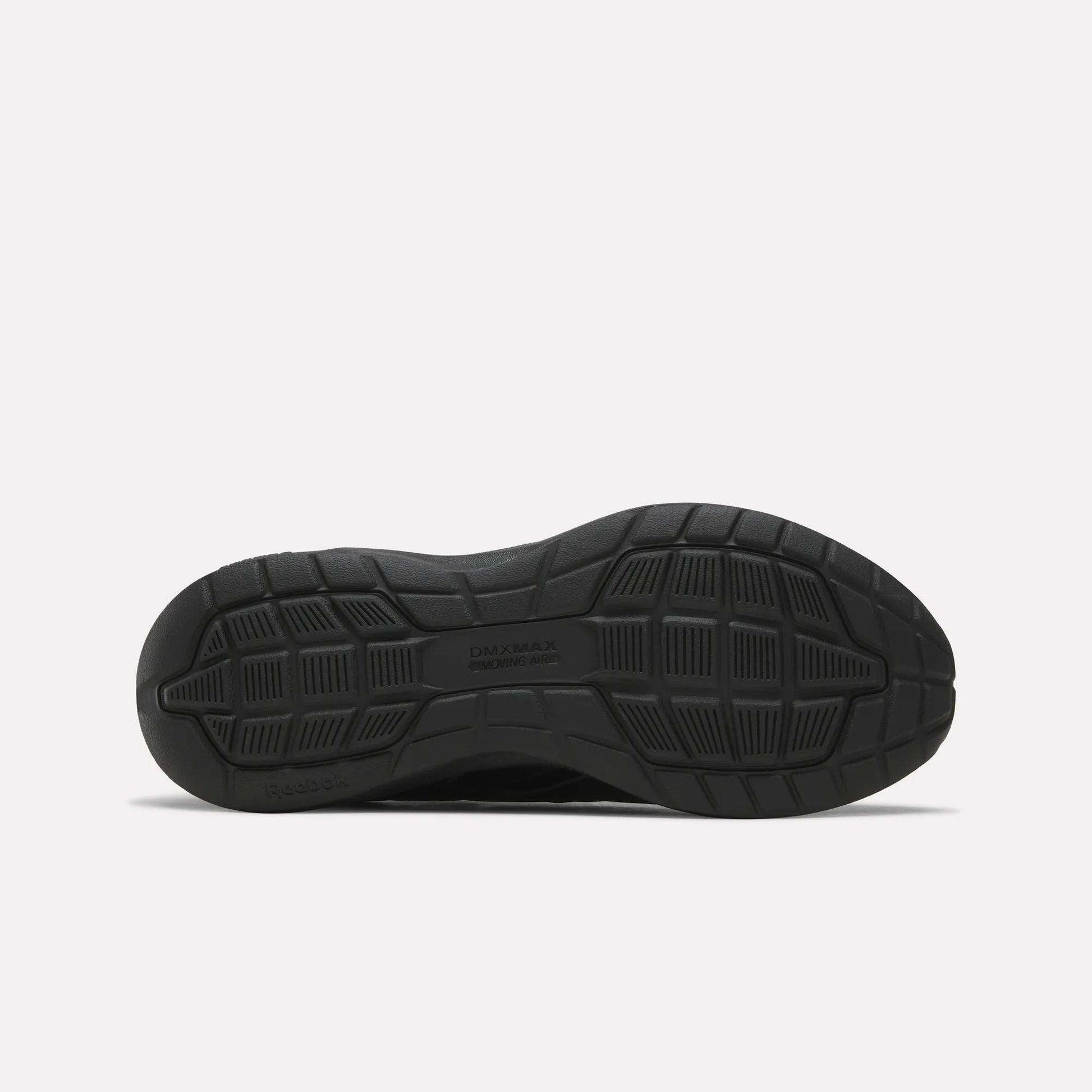 Black sneaker outsole viewed from the bottom, revealing a textured tread pattern with grooves and geometric shapes for traction—ideal for those seeking features similar to the Reebok Men's Walk Ultra 7 DMX Max Shoes - Wide 4E. The text DAY MAX and COLE HAAN are visible in the center.