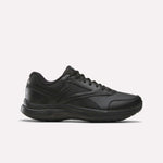 A side view of the Reebok Men's Walk Ultra 7 DMX Max Shoes - Wide 4E in Black/Cold Grey 5/Collegiate Royal is displayed on a plain white background, showcasing its lace-up design, low-cut profile, and textured sole with DMX cushioning for enhanced comfort.